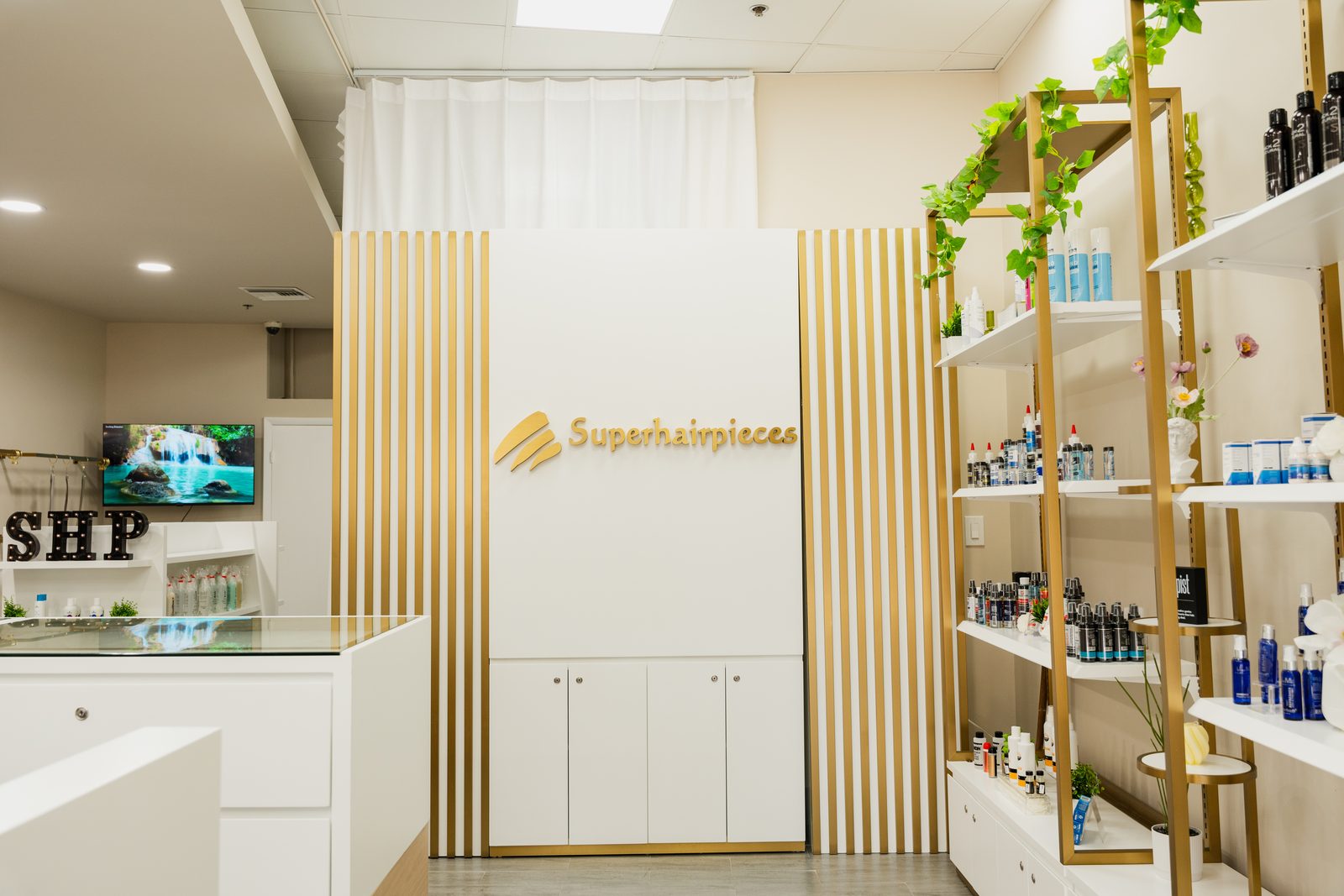 Superhairpieces retail wall at the Gen'C Pembroke Pines salon